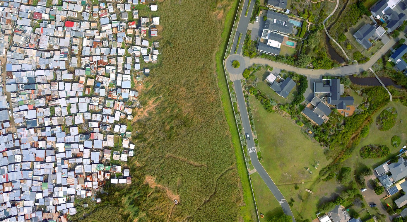 aerial view of townships facing rich neighborhoods, in a South Africa still prey to division.