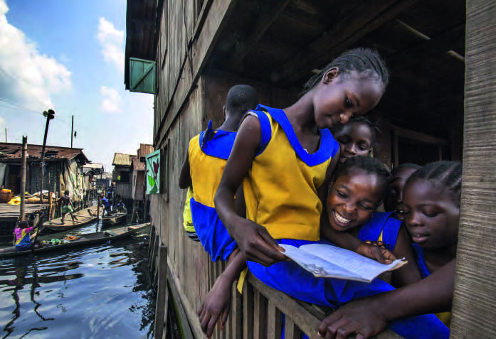 Children in Makoko, a shantytown built on built on stilts in the Lagos lagoon. ANDREW ESIEBO/PANOS/RÉA