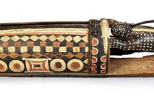 A 3.5-metre-long, 430-kilogram carved wooden slit drum, the Djidji Ayôkwé. —Quai Branly Museum