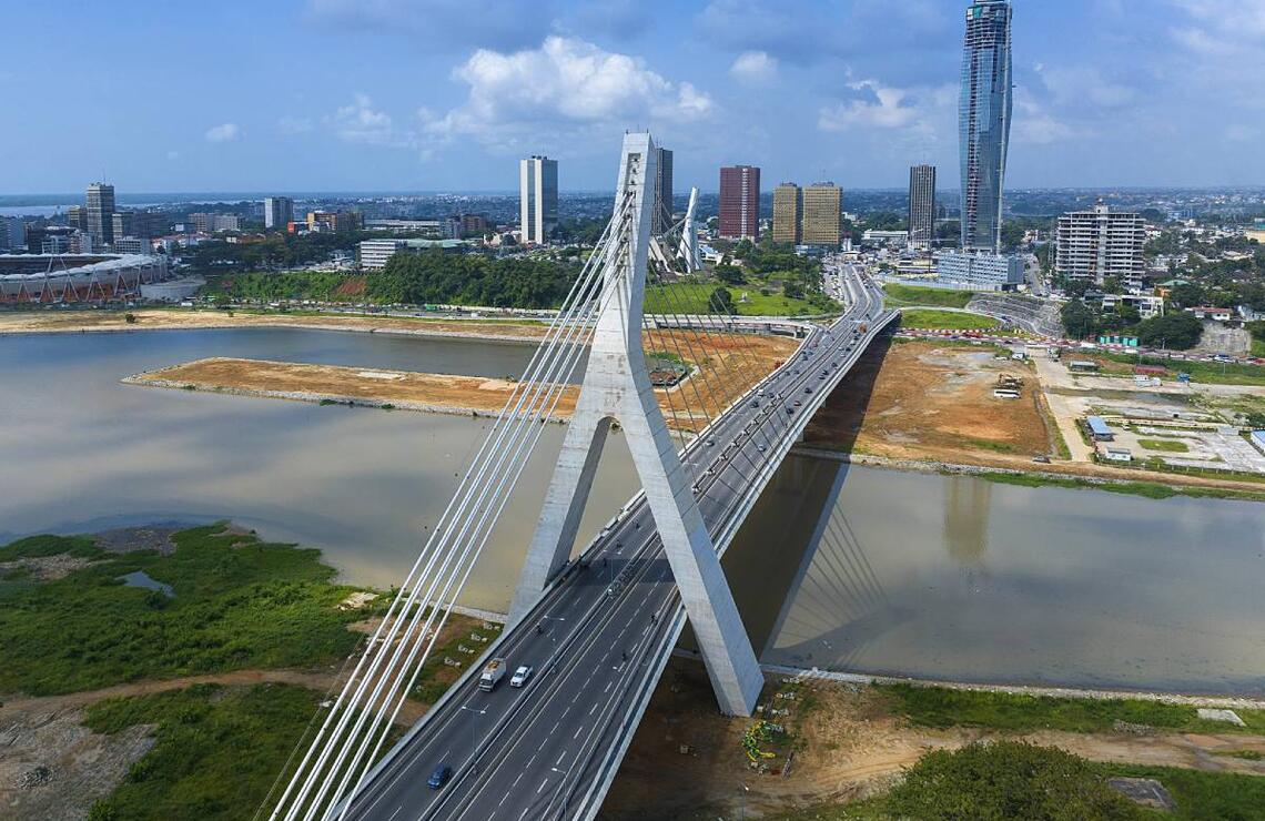 Epochal changes The new Cocody bridge and the ‘Tour F’ skyscraper under construction in the Plateau district. NABIL ZORKOT