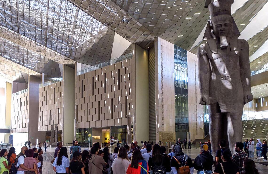 A monumental 3,200-year-old statue of Ramses II in the heart of the Grand Egyptian Museum, in the suburbs of Cairo. AMMAR ABD RABO
