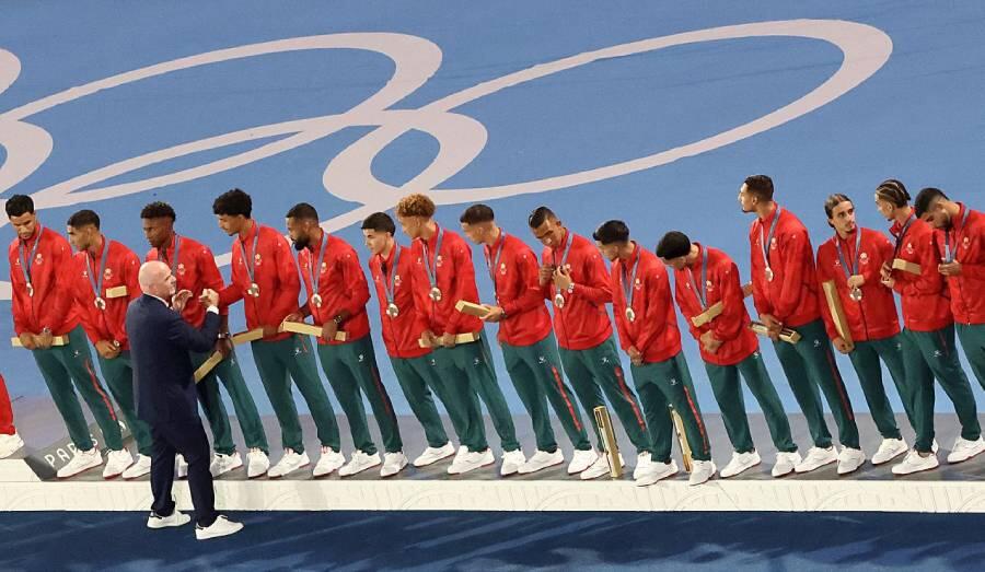 FIFA President Gianni Infantino congratulates the Moroccans on winning the bronze medal in football at the Olympic Games on 9 August 2024 at the Parc des Princes. JACK GUEZ/AFP