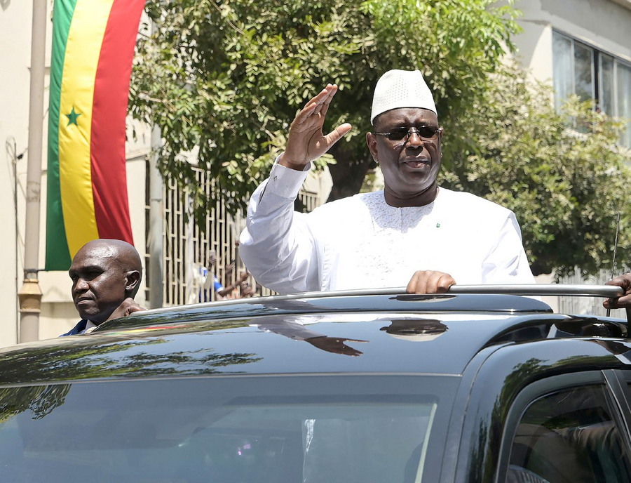 On April 2, 2024, Macky Sall leaves the palace and greets his supporters.  SEYLLOU/AFP